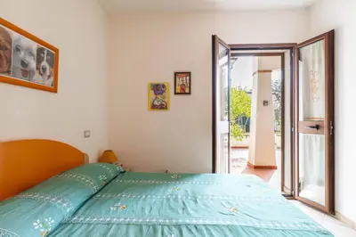 Letto o letti in una camera di Casa Vacanze Marconi a DONIGALA
