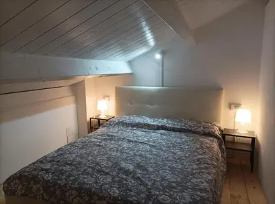 Letto o letti in una camera di Sant'Antioco appartamento moderno
