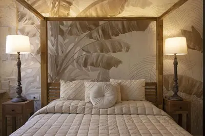 Letto o letti in una camera di La Maison Coloniale Suite e Zona Wellness free