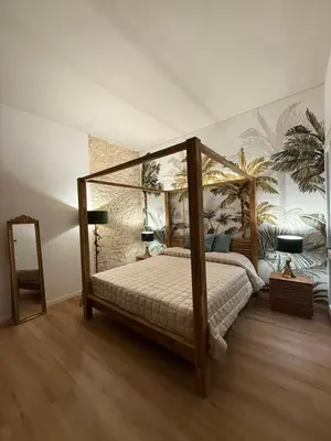 Letto o letti in una camera di La Maison Coloniale Suite e Zona Wellness free