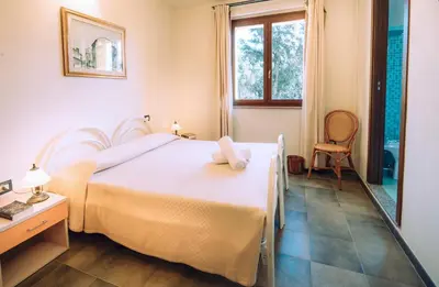 Letto o letti in una camera di Hotel with swimming pool in Arbus