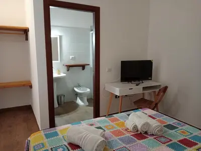 Letto o letti in una camera di il Guardiano delle due Baie Domus