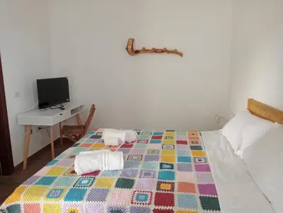 Letto o letti in una camera di il Guardiano delle due Baie Domus