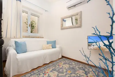 Letto o letti in una camera di Villasimius - Villa Sofia