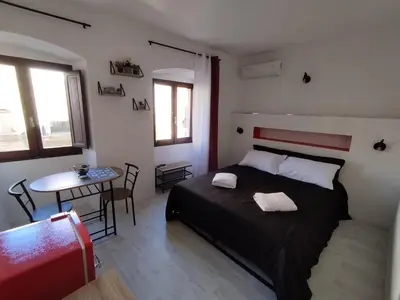 Letto o letti in una camera di B&B gli Ombrellini