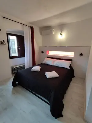 Letto o letti in una camera di B&B gli Ombrellini