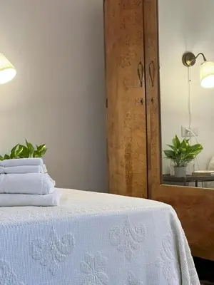 Letto o letti in una camera di Casa Manamunda