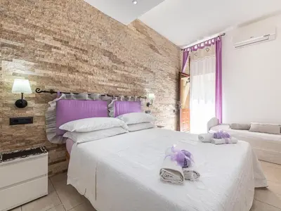 Letto o letti in una camera di Appartamento Il Lillà