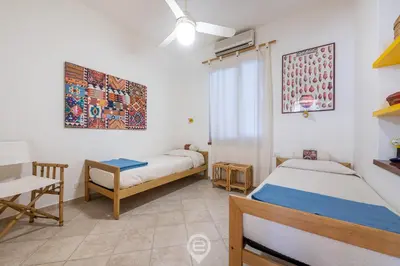 Letto o letti in una camera di Villa Mirto