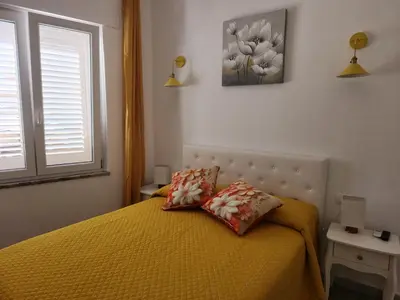 Letto o letti in una camera di Appartamento Le Rondini