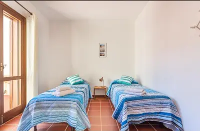 Letto o letti in una camera di Casa del Lentischio