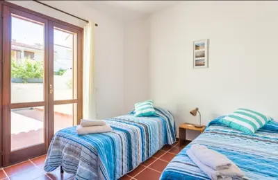 Letto o letti in una camera di Casa del Lentischio