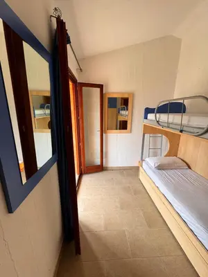 Letto o letti in una camera di Lovely and peaceful house 2 km form Porto Pino beach