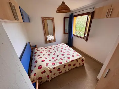 Letto o letti in una camera di Lovely and peaceful house 2 km form Porto Pino beach