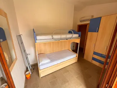 Letto o letti in una camera di Lovely and peaceful house 2 km form Porto Pino beach