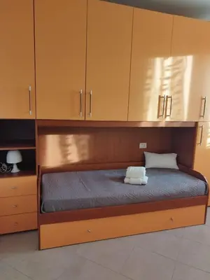 Letto o letti in una camera di Casa Marilù