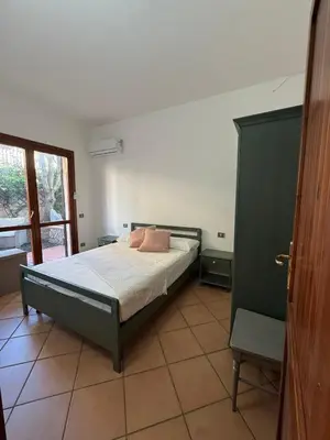 Letto o letti in una camera di Casa Vacanze Lina- Villasimius