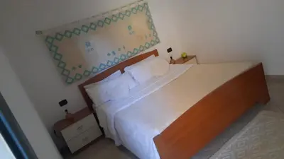 Letto o letti in una camera di Villa Fior di Loto Porto Corallo