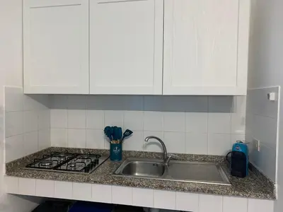 Cucina o angolo cottura di APPARTAMENTO CIELO pochi passi dal mare