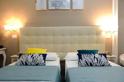 Letto o letti in una camera di Onda Marina Rooms