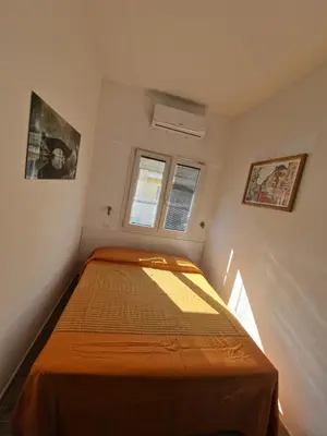 Letto o letti in una camera di Monolocale centrale Tortolì
