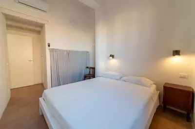 Letto o letti in una camera di Casa Tharros