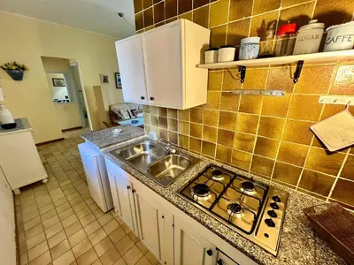 Cucina o angolo cottura di App Emily By La Via Del Mare Viaggi e Vacanze Villasimius