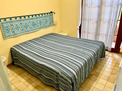 Letto o letti in una camera di App Emily By La Via Del Mare Viaggi e Vacanze Villasimius