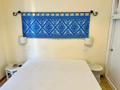 Letto o letti in una camera di App Emily By La Via Del Mare Viaggi e Vacanze Villasimius