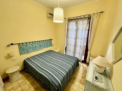 Letto o letti in una camera di App Emily By La Via Del Mare Viaggi e Vacanze Villasimius