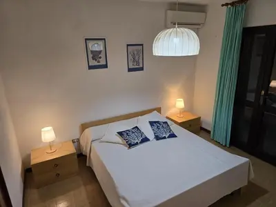 Letto o letti in una camera di le bouganville