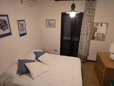 Letto o letti in una camera di le bouganville