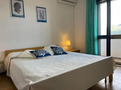 Letto o letti in una camera di le bouganville