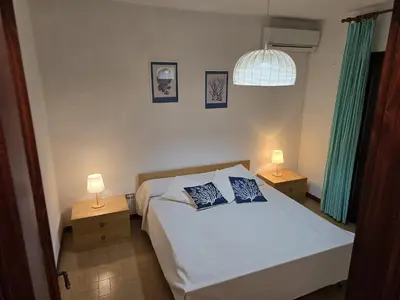 Letto o letti in una camera di le bouganville
