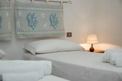 Letto o letti in una camera di Casa Mistral By La Via Del Mare Viaggi e Vacanze