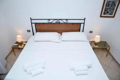 Letto o letti in una camera di Casa Mistral By La Via Del Mare Viaggi e Vacanze