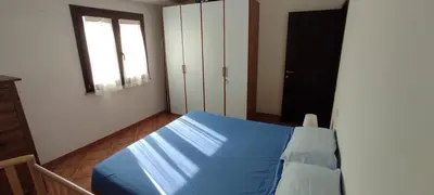 Letto o letti in una camera di Casa Fratelli close to the beach
