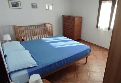 Letto o letti in una camera di Casa Fratelli close to the beach
