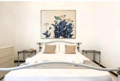 Letto o letti in una camera di Mare in pineta a due passi dal mare