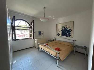 Letto o letti in una camera di Mare in pineta a due passi dal mare