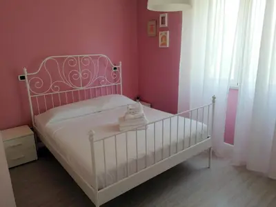 Letto o letti in una camera di CASA Vacanze Brezza Marina Piras Maria Cristiana