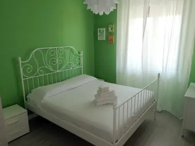 Letto o letti in una camera di CASA Vacanze Brezza Marina Piras Maria Cristiana