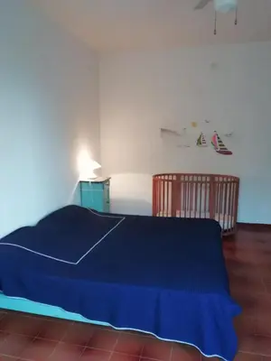 Letto o letti in una camera di Vista mare