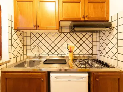 Cucina o angolo cottura di Apartment Baia delle Palme-1 by Interhome