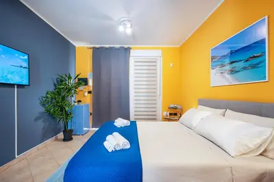 Letto o letti in una camera di Giardino Privato BBQ vicino Poetto