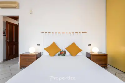 Letto o letti in una camera di Domu Arké by Propertize