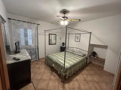 Letto o letti in una camera di Casa Vacanze DESIREE'