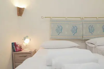 Letto o letti in una camera di Villa Oceania By La Via Del Mare Viaggi e Vacanze