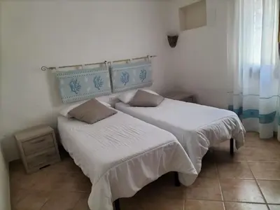 Letto o letti in una camera di Villa Oceania By La Via Del Mare Viaggi e Vacanze