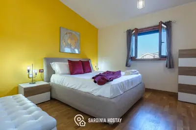 Letto o letti in una camera di Casa Aglaia
